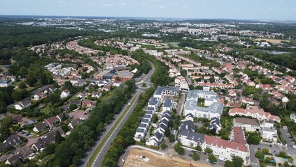 Fototapeta na wymiar Aerial view of residential houses in a green landscape