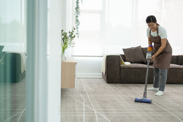 Woman cleaning house using vacuum cleaner. - obrazy, fototapety, plakaty