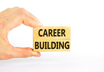 Career building symbol. Concept words Career building on beautiful wooden block. Beautiful white table white background. Businessman hand. Business, motivational career building concept. Copy space.