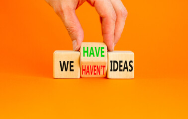 We have or not idea symbol. Concept word We have or have not ideas on beautiful wooden cubes. Beautiful orange table orange background. Business and we have or not idea concept. Copy space.