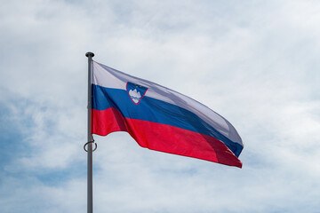 The national flag of Paraguay waving in the blue sky