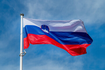 The national flag of Paraguay waving in the blue sky