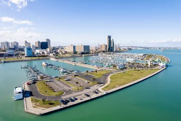 Fotobehang Aerial view of Corpus Christi Downtown Marina surrounded by buildings © Wirestock