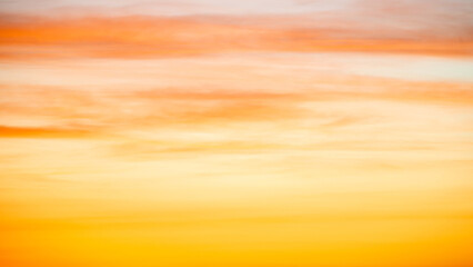 The dramatic colors of the sunset in the sky gradient from blue to orange.