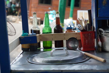 Mobile traders of chicken noodles, a traditional Indonesian food, sell their wares in the Malioboro area. Yogyakarta, Indonesia
