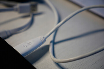 USB cable plugged into a laptop to copy date from hard drive