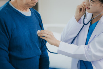 Female doctor talking taking care of her senior patient give support Doctor helping elderly patient with Alzheimer's disease A female attendant holds the hand of an elderly man