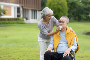 Senior couple taking care of each other in the park