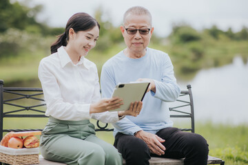 Asian woman caring for elderly patient