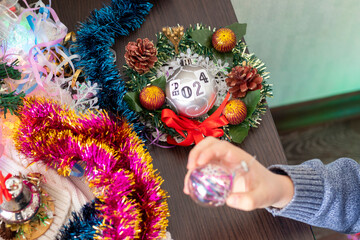 Close up shot of new year decorations. Little boy decorating christmas tree. New year changing numbers. Holiday