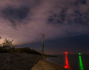 radar tower and navigation lights at night 