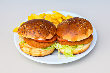 Big tasty burger, hamburger  with beef cutlet on a plate. Crispy chicken burger.