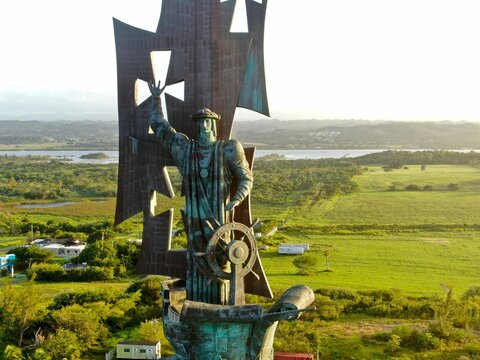 Scenic image of the Statue of Columbus, surrounded by lush green vegetation in Arecibo, Puerto Rico