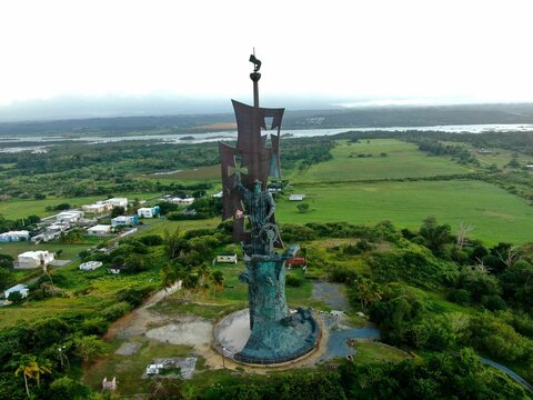 Scenic image of the Statue of Columbus, surrounded by lush green vegetation in Arecibo, Puerto Rico