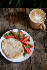 Breakfast. homemade flatbread with cheese and tomatoes