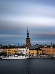 Fototapeta premium Scenic view of Stockholm, Sweden, and Riddarholmen Church on a cloudy day