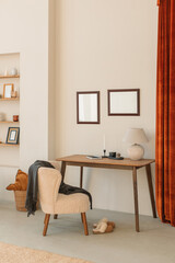 Empty photo frames on the wall in a stylish home office interior.