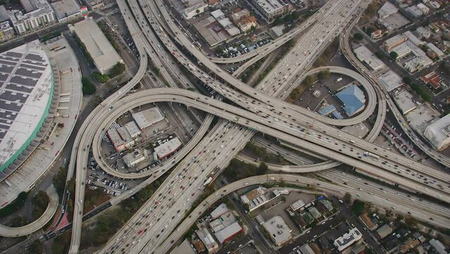 Aerial  view of Traffic in Interstate 110 and 10 Highway. Harbor Freeway Full of Cars. Los Angeles, California. United States. 
