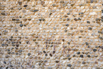 Historic old wall made of stones. Natural background.