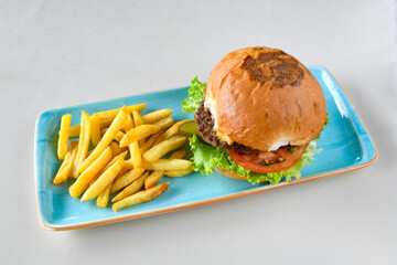 Big tasty burger, hamburger  with beef cutlet on a plate. Crispy chicken burger.