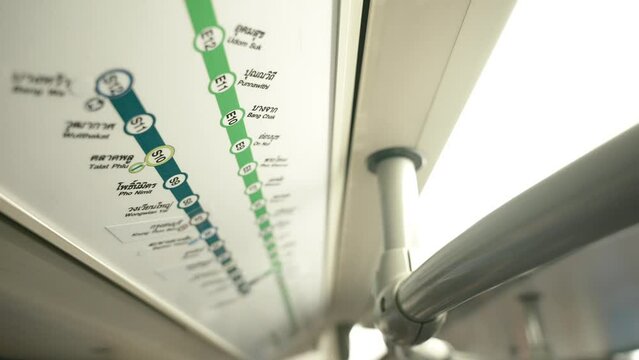 Close up of BTS Skytrain lines route map inside the train. Indication of stops on subway stations for passengers. Public transport infrastructure of the Bangkok city 