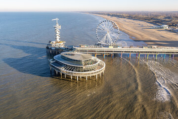 Aerial view Dutch pier Scheveningen with cityschape at The Hague