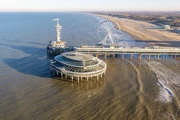 Fotobehang Aerial view Dutch pier Scheveningen with cityschape at The Hague © Kruwt