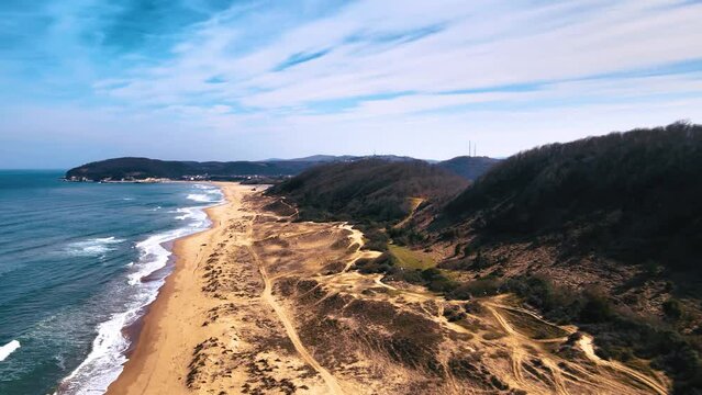 Long wavy sand beach in Agva Sile Istanbul TURKEY winter partly cloudy sunny weather high height aerial footage