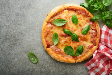 Margarita pizza. Traditional neapolitan margarita pizza and cooking ingredients tomatoes basil on wooden table backgrounds. Italian Traditional food. Top view. Mock up.