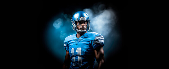 dynamic banner portrait of American football sportsman player in blue uniform on black background with smoke - obrazy, fototapety, plakaty