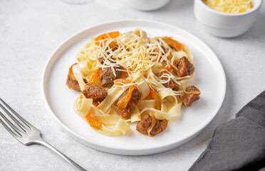 Beef slices pasta with onion and pepper in a plate
