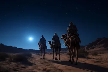 Fotobehang Christmas Jesus birth concept - Adoration of the Magi, Three Wise Men, Three Kings, and the Three biblical Magi with camel silhouettes journeying in sand dunes of desert follow Bethlehem star at night © Dmitry Rukhlenko