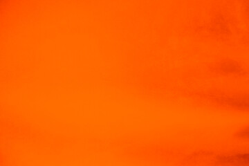 Orange velvet fabric texture used as background. Orange color panne fabric background of soft and...