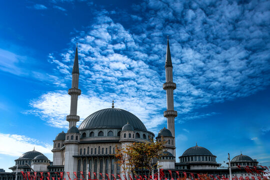 View of Taksim mosque in Istanbul with Turkish flags with beautiful clouds