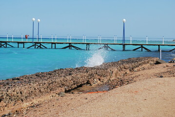 Fototapeta na wymiar Sea pier. Amazing Red sea with aquamarine color. No filters.
