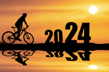 welcome 2024 happy new year and happy festival silhouette of cyclist in 2024