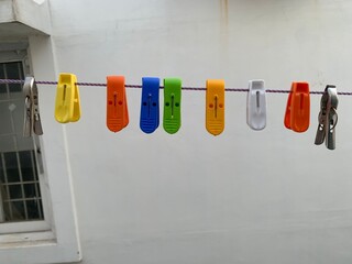 clothes peg on a clothesline with cloth clips