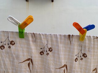 clothes peg on a clothesline with cloth clips