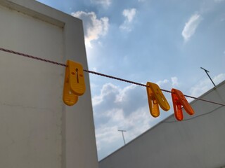 clothes peg on a clothesline with cloth clips