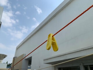 clothes peg on a clothesline with cloth clips