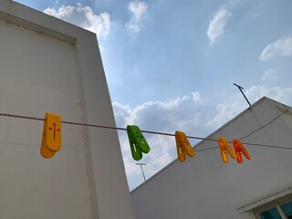 clothes peg on a clothesline with cloth clips