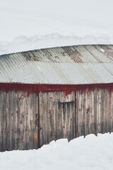 an abandoned summer barn in winter
