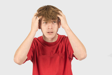 Headshot of a shocked teenage boy