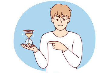 Smiling young man point at sandglass show sand flowing and time passing. Happy male show with finger and hourglass. Vector illustration.