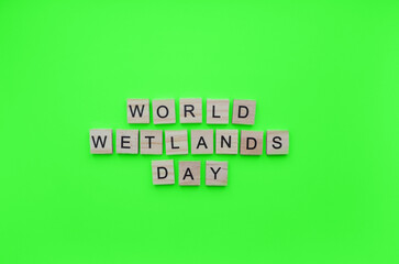 February 2, World Wetlands Day, minimalistic banner with the inscription in wooden letters