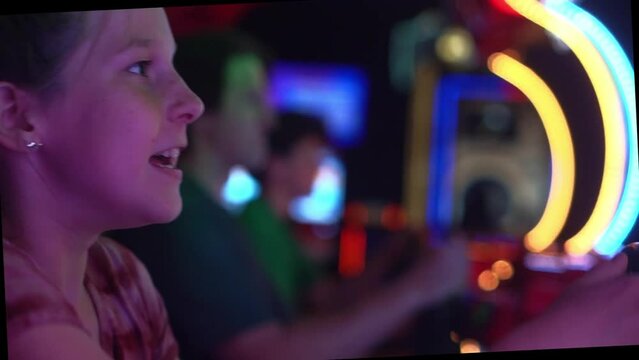 Playing in an arcade with neon lights