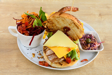 Big tasty burger with beef cutlet on a plate. Hamburger. Crispy chicken burger.