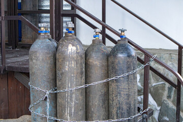 Close-up of steel cylinders with compressed gas - argon, carbon dioxide or oxygen for welding, outdoors