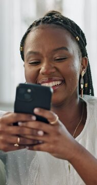 Woman, laughing or typing on smartphone on sofa, happy for contact conversation, funny chat or living room. Black person, cellphone or connect on social media, technology or online post or relax home
