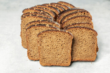 sliced rye bread with coriander grains on the table